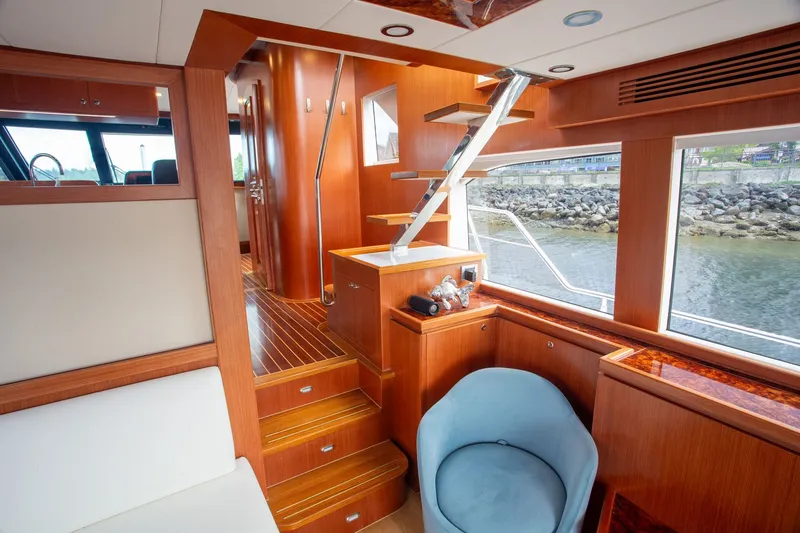 Slide: The Image of Interior of Apollonian Yachts 52, 2025 model, featuring modern wood paneling. - 14