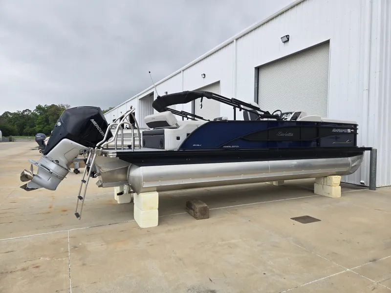 Slide: The Image of 2021 Barletta 23U CORSA pontoon boat on concrete blocks. - 2