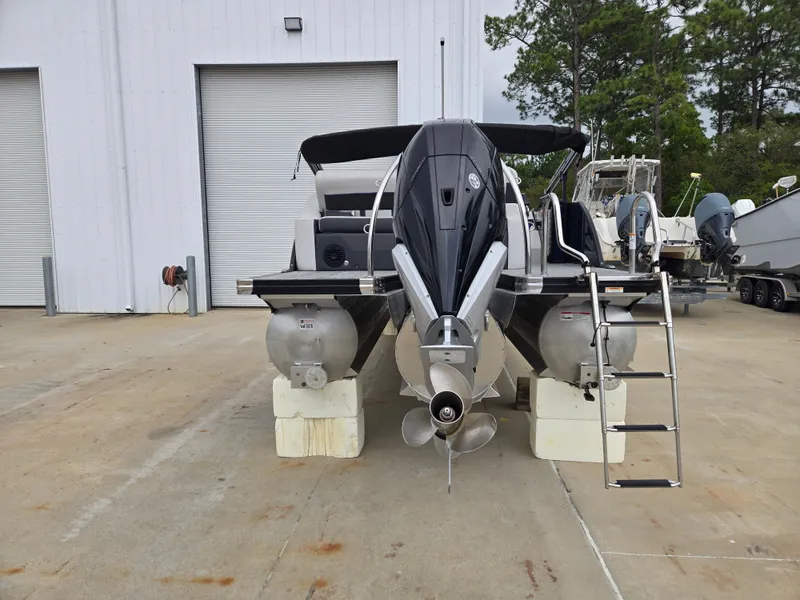 Slide: The Image of 2021 Barletta 23U CORSA pontoon boat parked outdoors. - 3