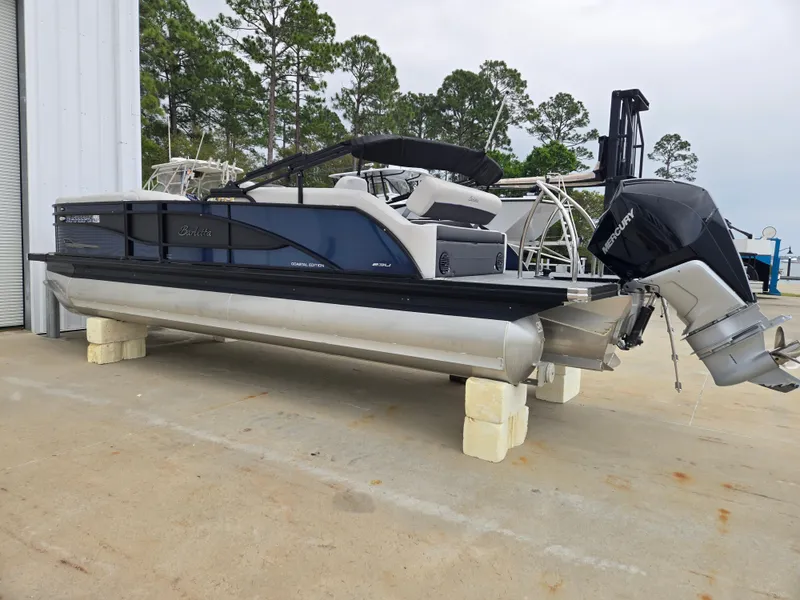 Slide: The Image of 2021 Barletta 23U CORSA pontoon boat stored on land. - 4