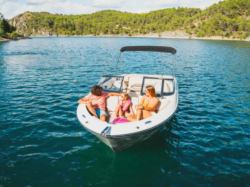 Slide: The Image of Family enjoying boat ride on Bayliner V20i, 2026 model. - 5