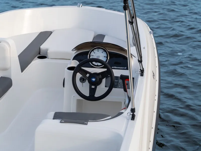Slide: The Image of Interior view of Bayliner Element E16 boat, 2026 model, on the water. - 4