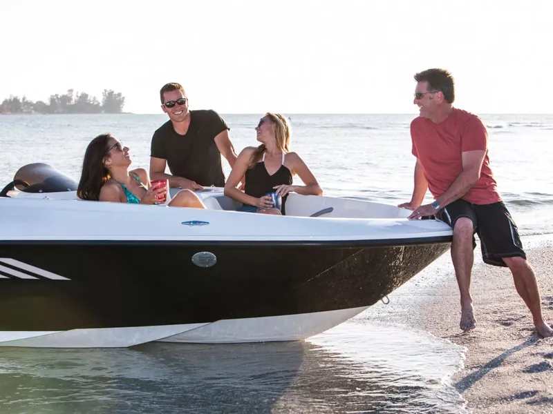 Slide: The Image of People enjoying the Bayliner Element E16 at the beach. - 5