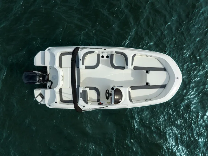 Slide: The Image of Aerial view of 2026 Bayliner Element E16 boat on water. - 8
