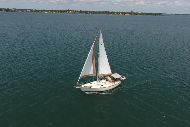 The Image of Sailboat Island Packet 35 (1994) cruising on open water under clear skies. - 1