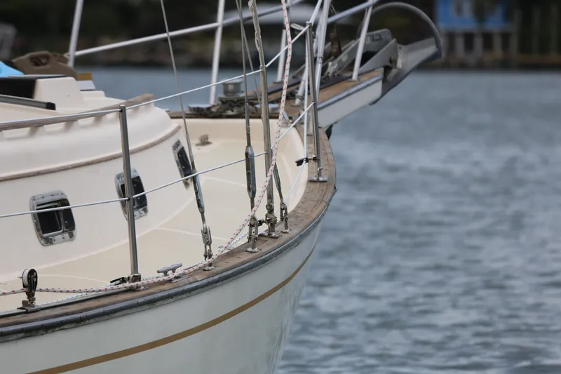 Slide: The Image of Close-up of a 1994 Island Packet 35 sailboat on calm water. - 14