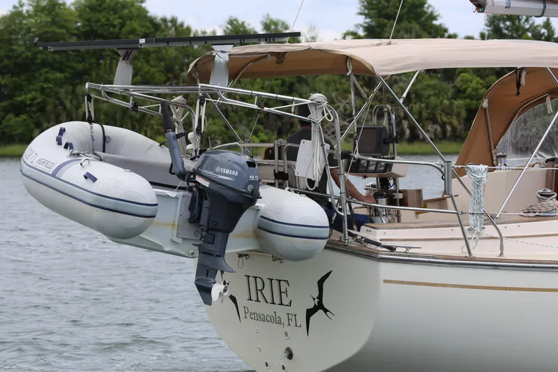 Slide: The Image of Island Packet 35 sailboat with dinghy and Yamaha motor, docked in Pensacola, FL, 1994 model. - 15