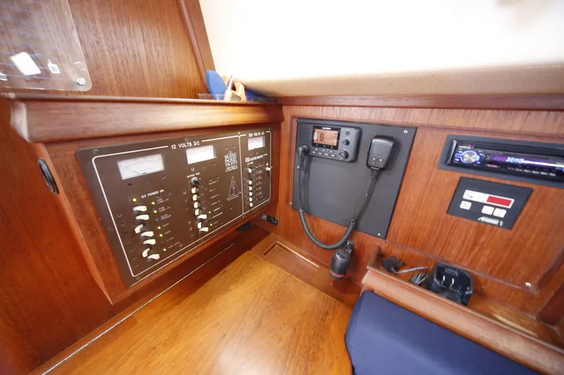 Slide: The Image of Control panel of a 1994 Island Packet 35 sailboat with navigation and communication equipment. - 33