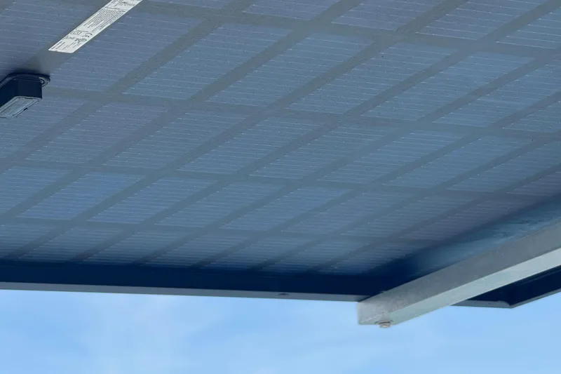 Slide: The Image of Solar panel installation on a roof, showcasing grid pattern and clear blue sky. - 39