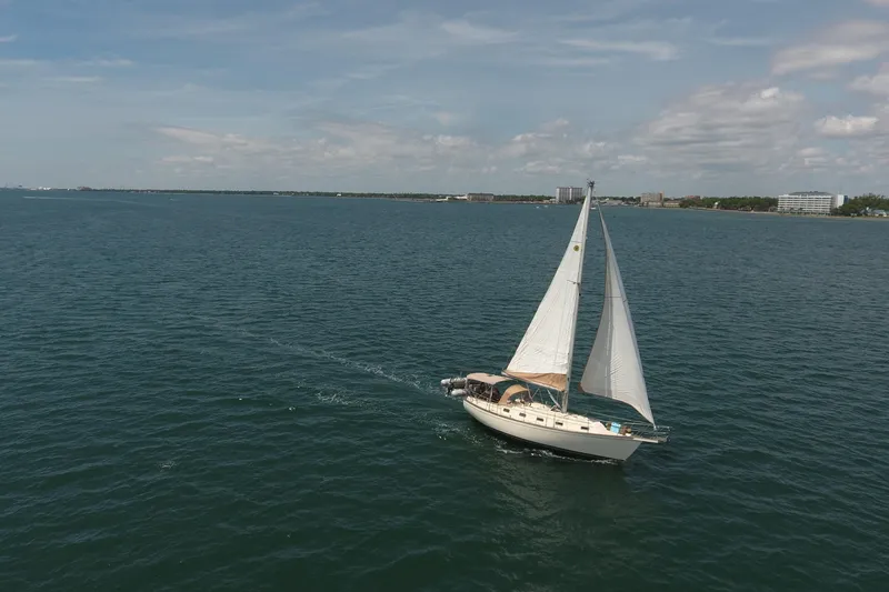 Slide: The Image of Sailboat Island Packet 35 (1994) cruising on open water under clear skies. - 4