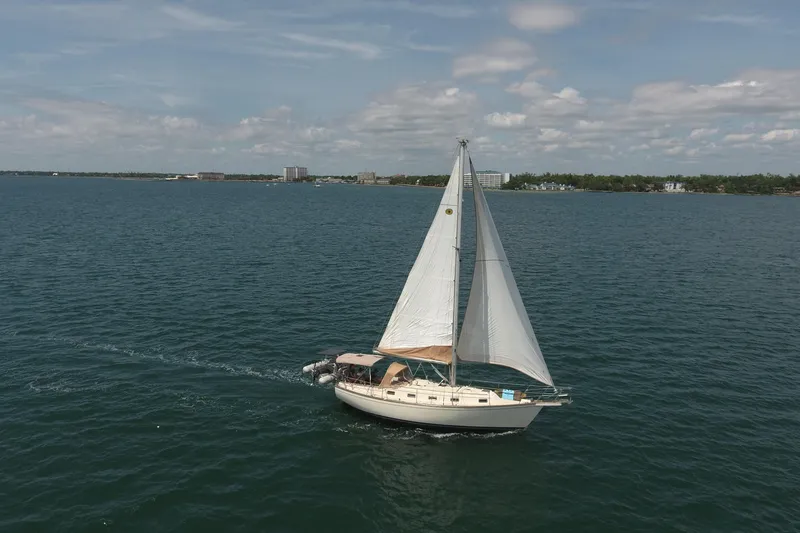 Slide: The Image of Sailboat Island Packet 35 (1994) cruising on open water under clear skies. - 5