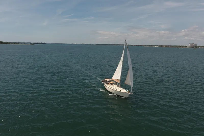 Slide: The Image of Sailboat Island Packet 35 (1994) cruising on open water under clear skies. - 6