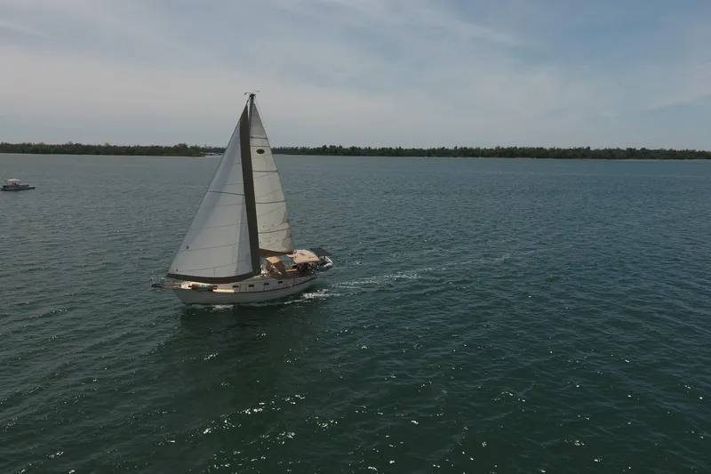 Slide: The Image of Sailboat Island Packet 35 (1994) cruising on open water under clear skies. - 7