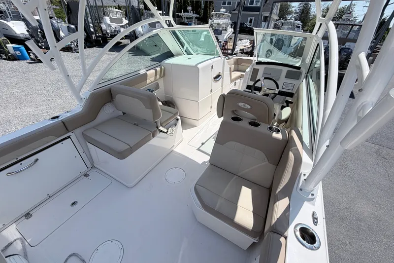 Slide: The Image of 2021 Sailfish 245 DC boat interior with seating and steering console. - 27