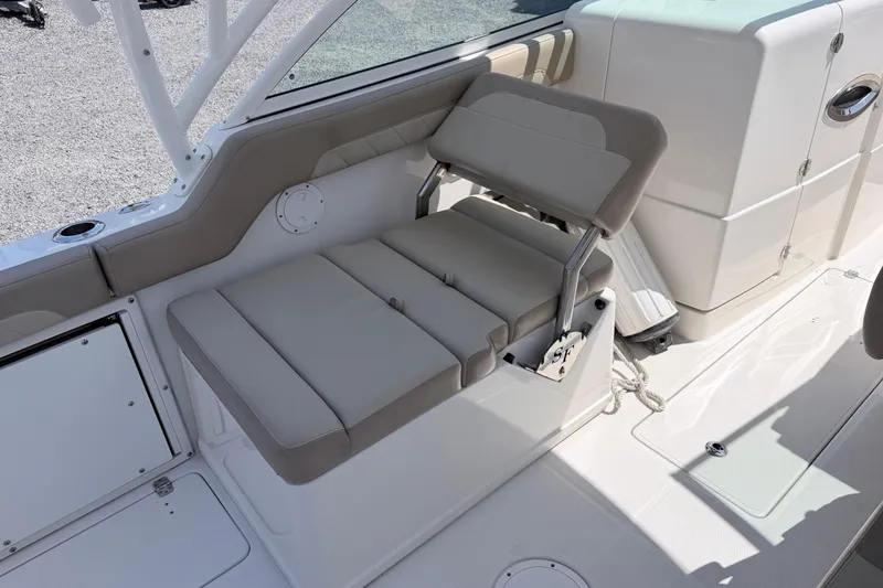 Slide: The Image of 2021 Sailfish 245 DC boat interior with beige seating and modern design. - 31