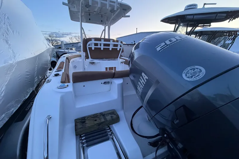 Slide: The Image of 2022 Sea Hunt Ultra 234 boat with Yamaha 200 engine at dockside. - 13