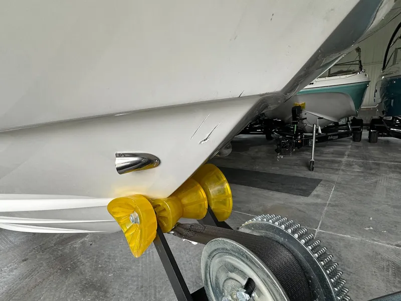 Slide: The Image of 2024 Sea Ray SDX 250 boat hull on trailer in storage. - 10