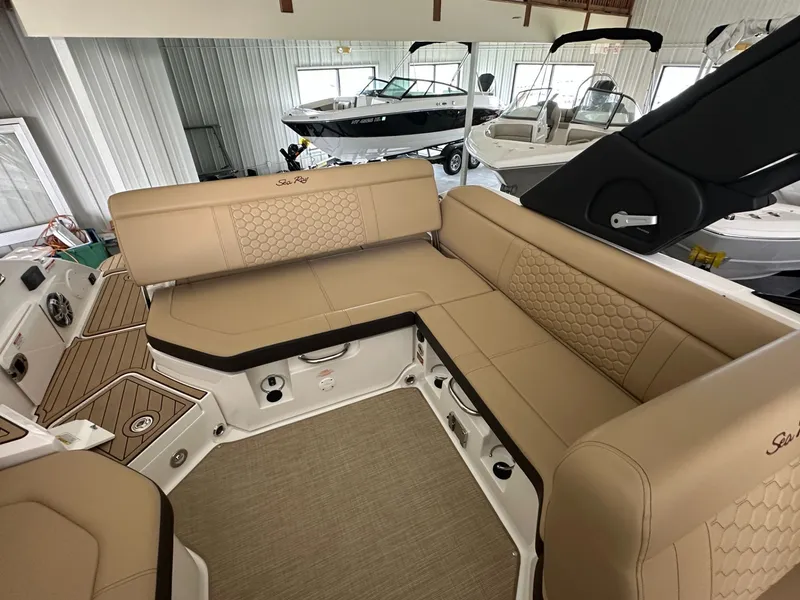 Slide: The Image of Interior of 2024 Sea Ray SDX 250 boat with beige upholstery. - 16