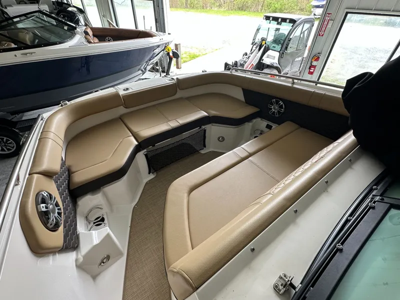 Slide: The Image of Interior of 2024 Sea Ray SDX 250 with beige seating. - 19