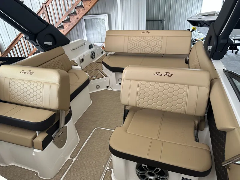 Slide: The Image of Interior of 2024 Sea Ray SDX 250 with beige leather seating. - 23