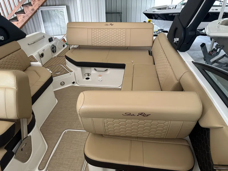 Slide: The Image of Interior of 2024 Sea Ray SDX 250 boat with beige upholstery. - 24