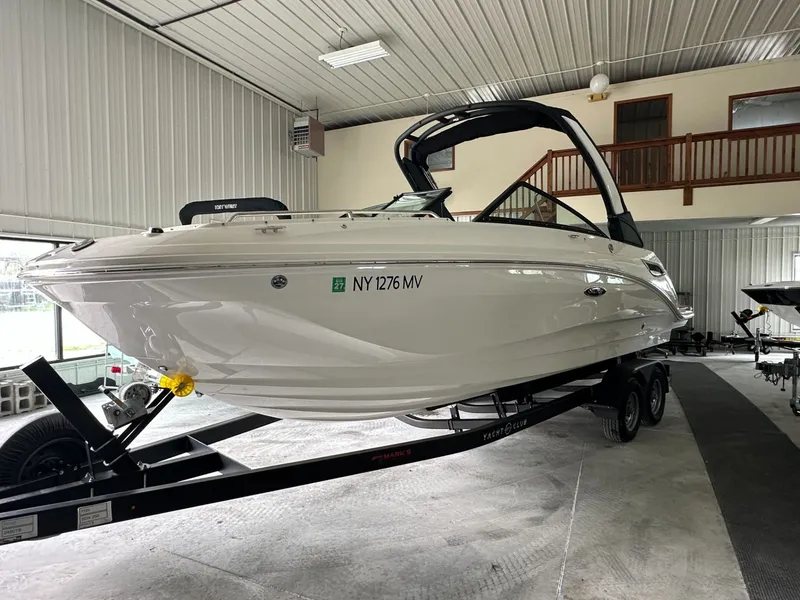 Slide: The Image of 2024 Sea Ray SDX 250 boat in a garage on a trailer. - 3