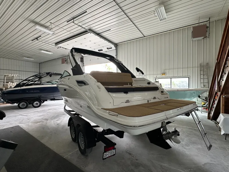 Slide: The Image of 2024 Sea Ray SDX 250 boat in a storage facility. - 6