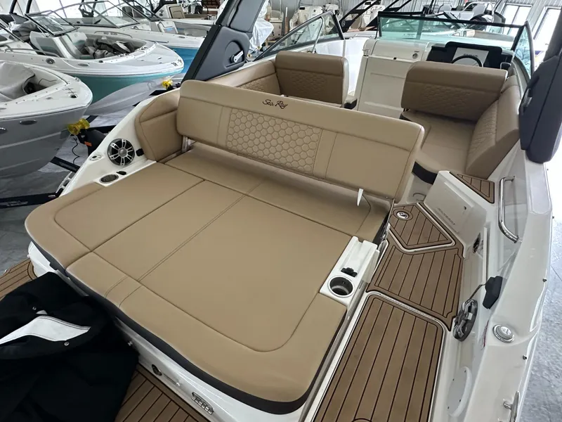 Slide: The Image of Interior of a 2024 Sea Ray SDX 250 boat with beige seating. - 8