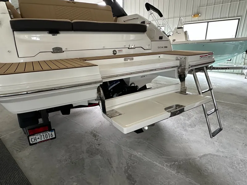 Slide: The Image of 2024 Sea Ray SDX 250 with retractable swim platform. - 9