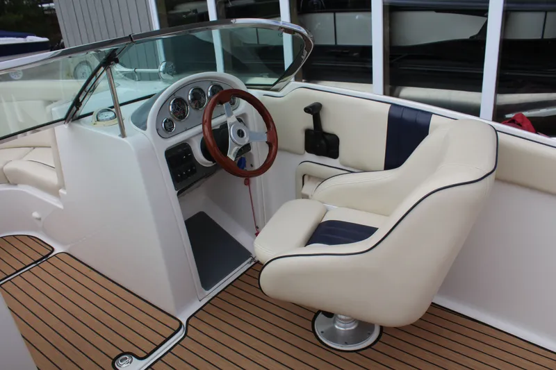 Slide: The Image of Interior of a 2005 Chris-Craft Launch 22 with wood trim. - 11
