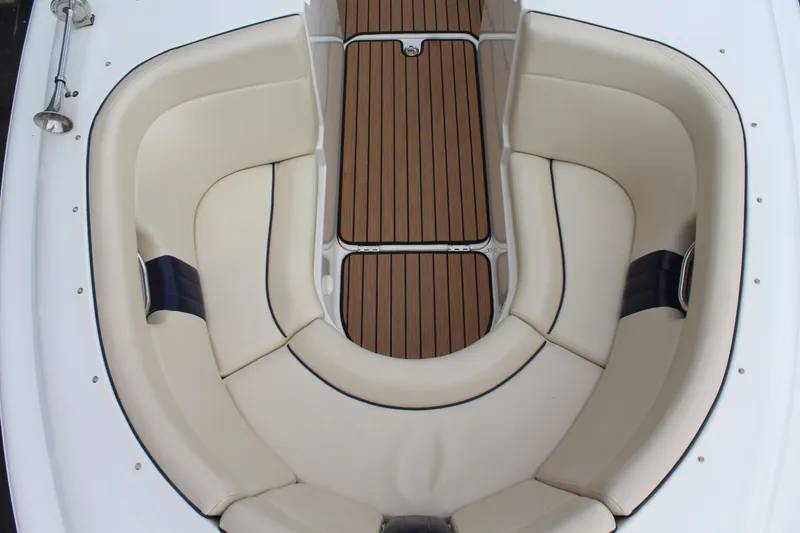 Slide: The Image of Interior of a 2005 Chris-Craft Launch 22 with cream seats. - 14