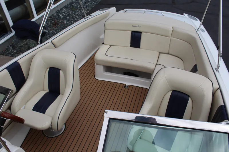 Slide: The Image of Interior of a 2005 Chris-Craft Launch 22 with cream seats. - 15