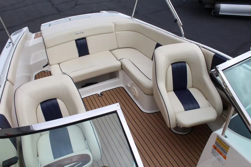 Slide: The Image of Interior of a 2005 Chris-Craft Launch 22 with cream seats. - 16