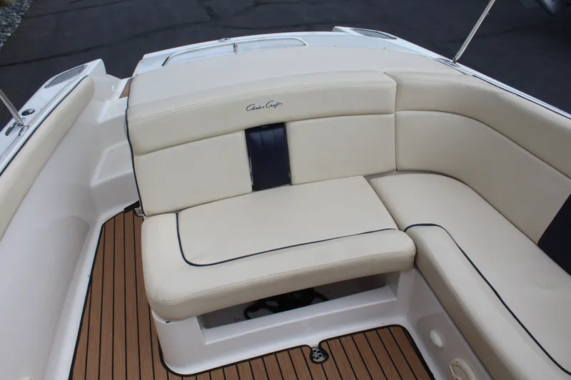 Slide: The Image of Interior of a 2005 Chris-Craft Launch 22 with cream seating. - 17