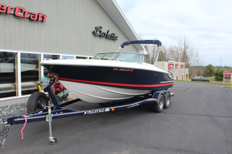 Slide: The Image of 2005 Chris-Craft Launch 22 boat on trailer outside a building. - 4