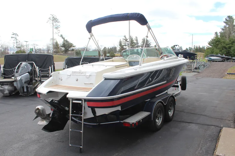 Slide: The Image of 2005 Chris-Craft Launch 22 boat parked on trailer outdoors. - 6