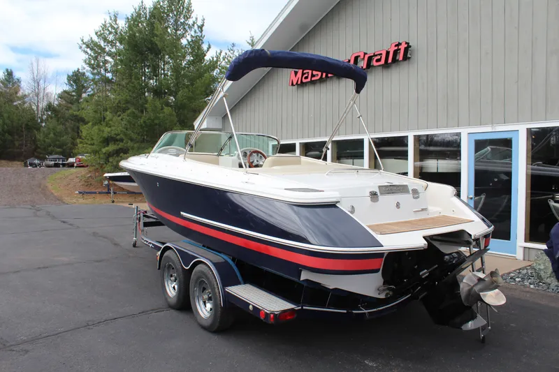 Slide: The Image of 2005 Chris-Craft Launch 22 boat on trailer outside building. - 7