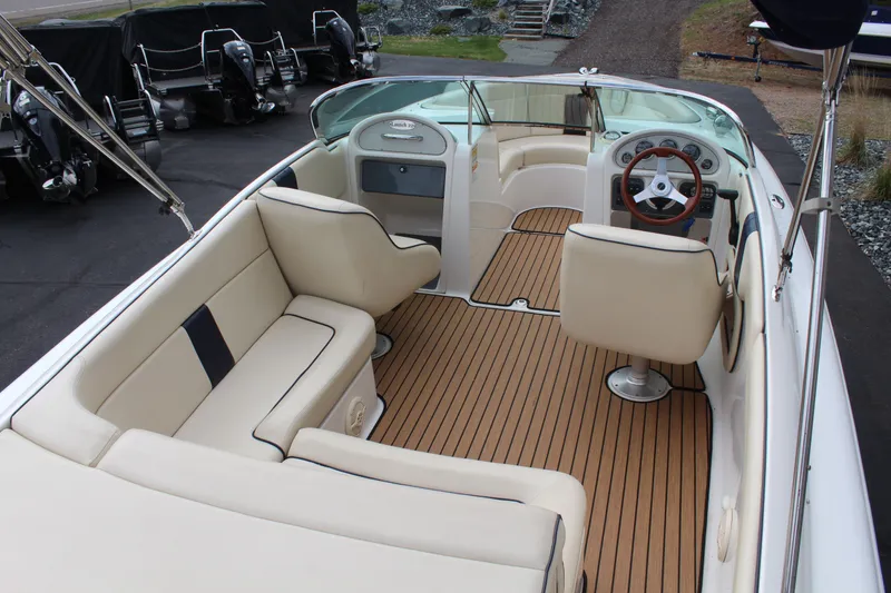 Slide: The Image of Interior of a 2005 Chris-Craft Launch 22 boat with wooden flooring. - 8
