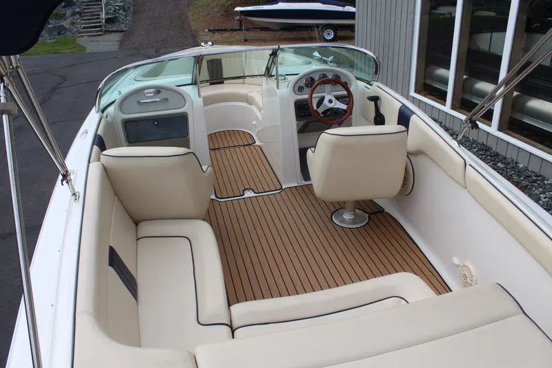 Slide: The Image of Interior of a 2005 Chris-Craft Launch 22 boat with wooden flooring. - 9