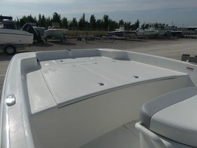 Slide: The Image of 2026 Mako Pro Skiff 17 CC boat deck in parking area. - 12