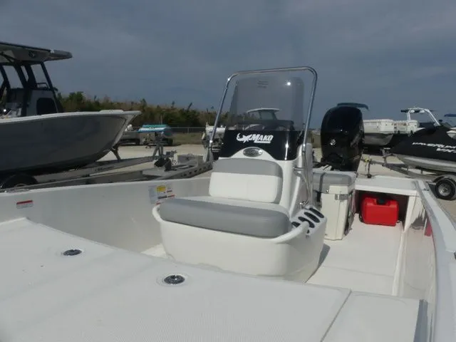Slide: The Image of 2026 Mako Pro Skiff 17 CC boat on a trailer. - 13