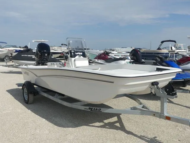 Slide: The Image of 2026 Mako Pro Skiff 17 CC on trailer at marina. - 3
