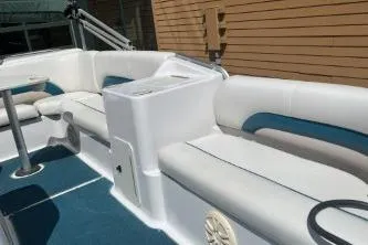 Slide: The Image of 2000 Hurricane FunDeck 198 RE boat interior with white and blue seating. - 10