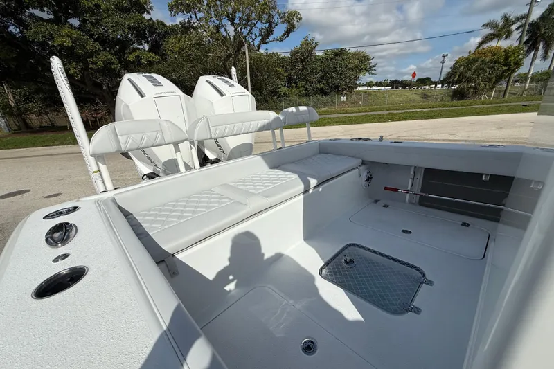 Slide: The Image of 2026 Yellowfin 26 Hybrid boat interior with dual engines and seating area. - 24