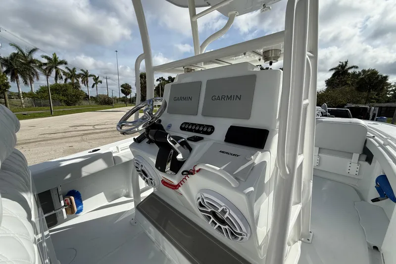 Slide: The Image of 2026 Yellowfin 26 Hybrid boat console with Garmin displays and Mercury controls. - 7
