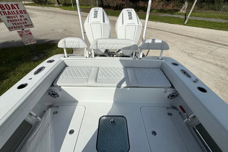Slide: The Image of 2026 Yellowfin 26 Hybrid boat interior with seating and twin engines. - 8