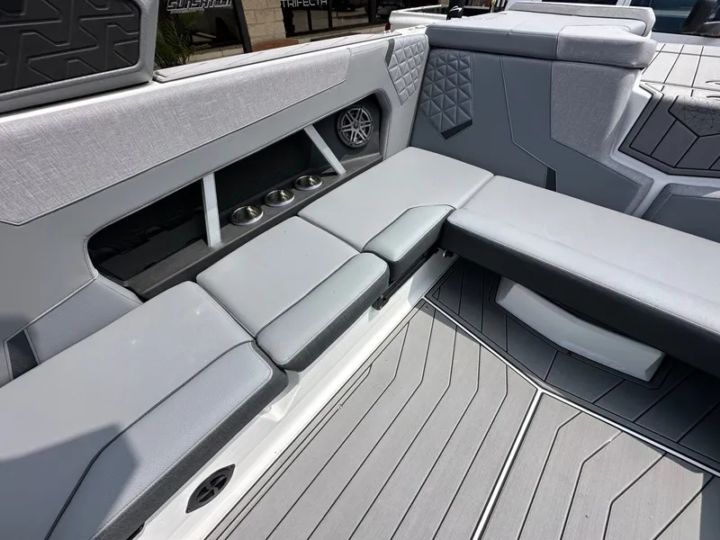 Slide: The Image of Interior of 2026 Nautique Super Air Nautique GS22 with gray upholstery. - 11