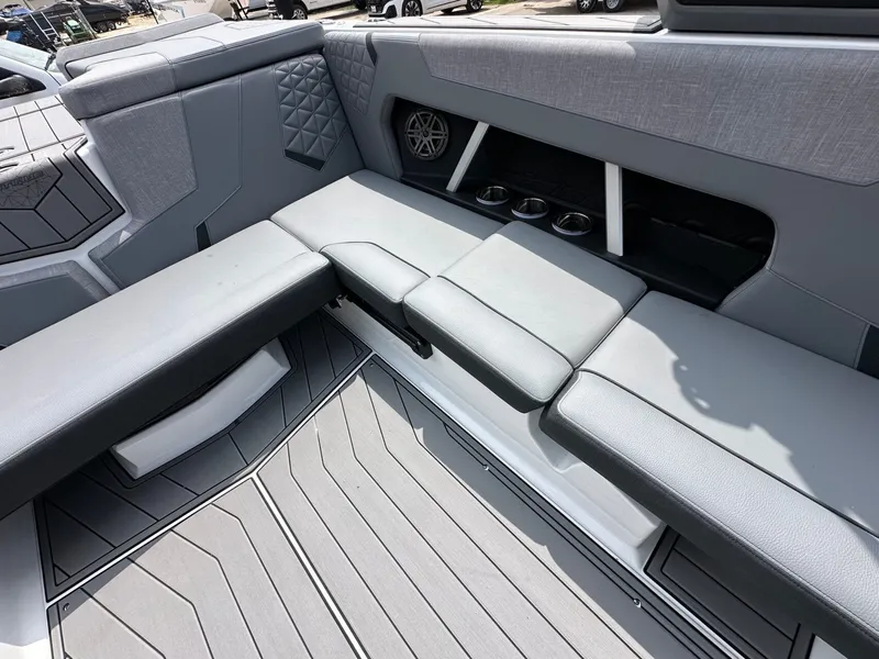 Slide: The Image of Interior of 2026 Nautique Super Air Nautique GS22 with gray upholstery. - 13