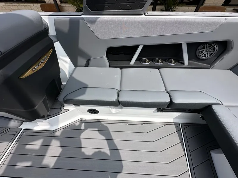 Slide: The Image of Interior of 2026 Nautique Super Air Nautique GS22 with gray seating. - 17