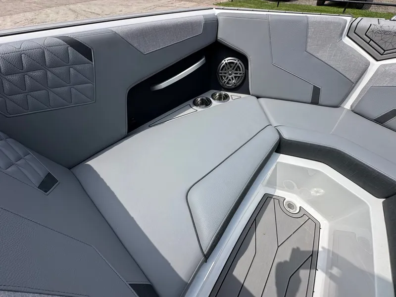 Slide: The Image of Interior of 2026 Nautique Super Air Nautique GS22 with gray upholstery. - 18